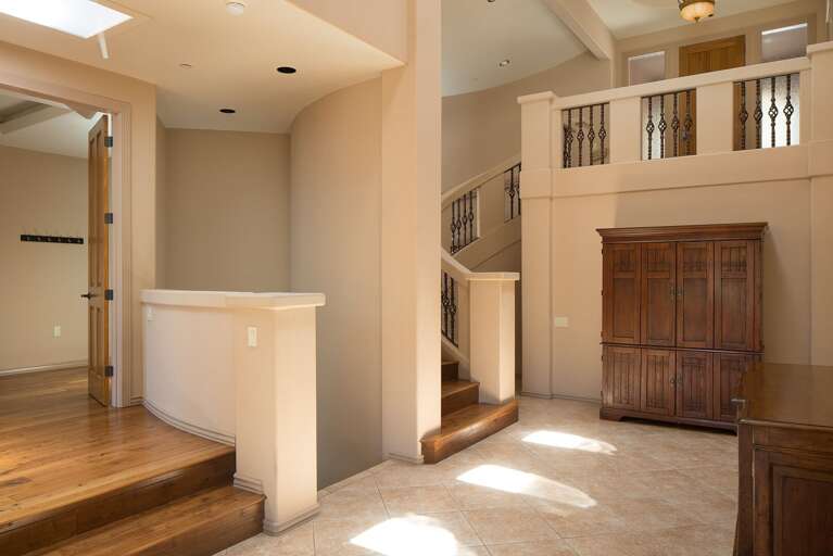 Adorned with marble, tile, and wood in elegant neutral tones, the space exudes sophistication and comfort. Adorned with marble, tile, and wood in elegant neutral tones, the space exudes sophistication and comfort.