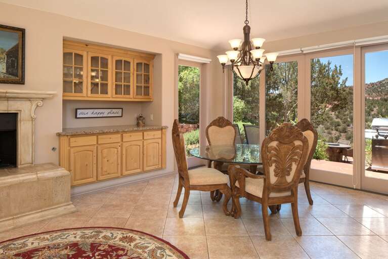 Gather around the 4-seater dining table, where you can enjoy meals while taking in the views from the large windows. Perfect for family meals or intimate dinners Gather around the 4-seater dining table, where you can enjoy meals while taking in the views from the large windows. Perfect for family meals or intimate dinners