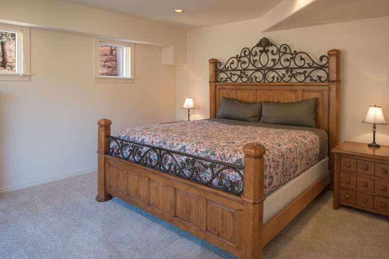 Relax in this spacious bedroom with a king-sized bed, complete with soft linens and tranquil views. Relax in this spacious bedroom with a king-sized bed, complete with soft linens and tranquil views.