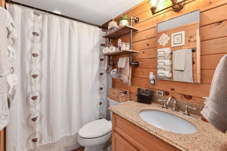 Adjacent hallway bathroom with a shower/tub combo Adjacent hallway bathroom with a shower/tub combo