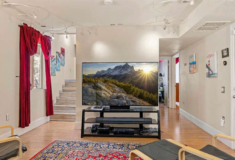 Lower Family Room: Entertainment-ready with a 75β HD Smart TV and luxurious seating. Additional Sleeping Arrangements: Queen air mattress in ottoman. Lower Family Room: Entertainment-ready with a 75β HD Smart TV and luxurious seating. Additional Sleeping Arrangements: Queen air mattress in ottoman.