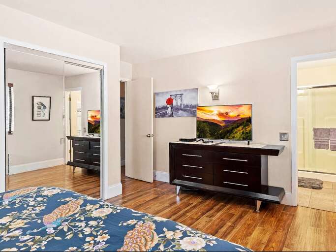 Master Bedroom - 1st Floor: Features a luxurious king-size bed, an ensuite bathroom with double Master Bedroom - 1st Floor: Features a luxurious king-size bed, an ensuite bathroom with double