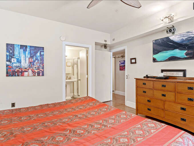 Second Master Bedroom with patio access - 2nd Floor: Elegantly designed with a plush king-size bed Second Master Bedroom with patio access - 2nd Floor: Elegantly designed with a plush king-size bed