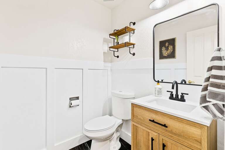 Half Bathroom: Located near the entrance to the garage for guest convenience. Half Bathroom: Located near the entrance to the garage for guest convenience.