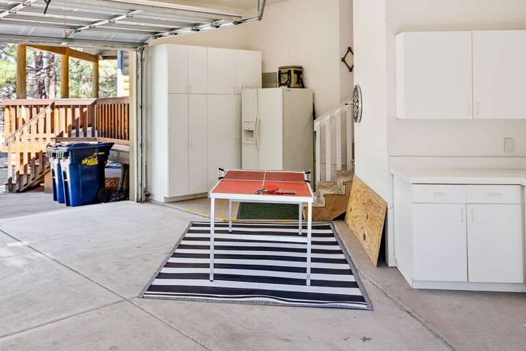 The excitement carries into the converted garage, now transformed into a vibrant game room perfect The excitement carries into the converted garage, now transformed into a vibrant game room perfect