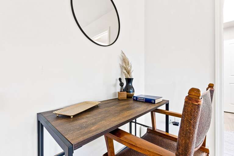 Guest Bedroom 1: King-size bed, dedicated workspace, flat-screen smart TV, and access to a shared jack-and-jill bathroom. Guest Bedroom 1: King-size bed, dedicated workspace, flat-screen smart TV, and access to a shared jack-and-jill bathroom.