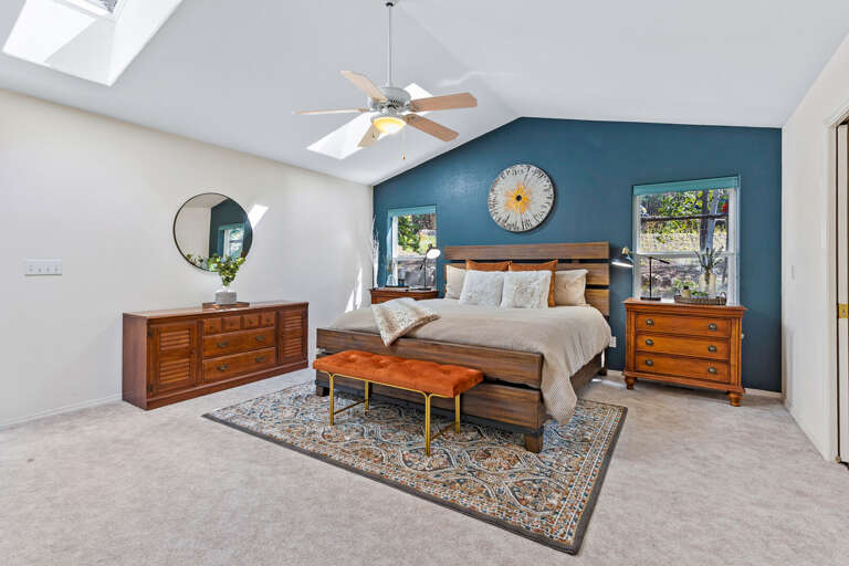 Primary Suite: King-size bed, media center with an electric fireplace, private backyard access, and en suite with jetted bathtub, dual vanity, and walk-in closet. Primary Suite: King-size bed, media center with an electric fireplace, private backyard access, and en suite with jetted bathtub, dual vanity, and walk-in closet.