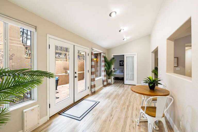 A cozy sunroom with serene patio views, perfect for enjoying the outdoors in any weather. A cozy sunroom with serene patio views, perfect for enjoying the outdoors in any weather.