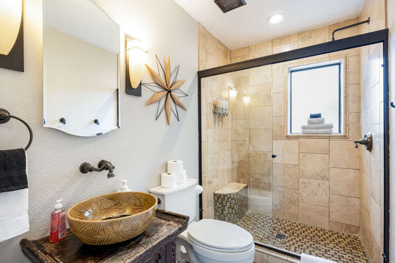 Full Bathroom 3: This shared bath features a walk-in shower and modern fixtures. Full Bathroom 3: This shared bath features a walk-in shower and modern fixtures.