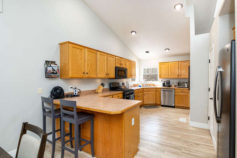 The fully equipped gourmet kitchen and spacious dining area make it easy to prepare and enjoy meals together The fully equipped gourmet kitchen and spacious dining area make it easy to prepare and enjoy meals together