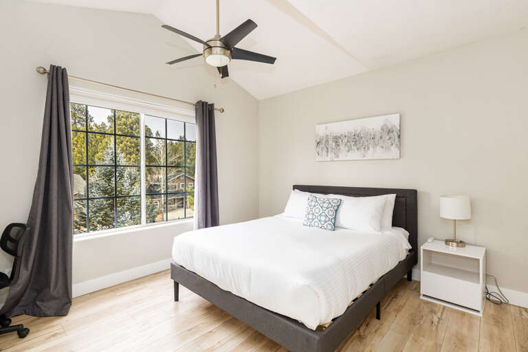 Guest Bedroom 2: Queen-size bed with cozy bedding, mountain views, dedicated workspace and large clothing storage. Guest Bedroom 2: Queen-size bed with cozy bedding, mountain views, dedicated workspace and large clothing storage.