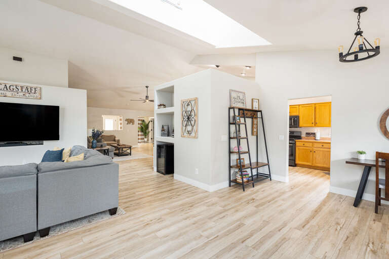 Open-concept layout with plush seating and a gas fireplace for a warm, inviting atmosphere. Open-concept layout with plush seating and a gas fireplace for a warm, inviting atmosphere.