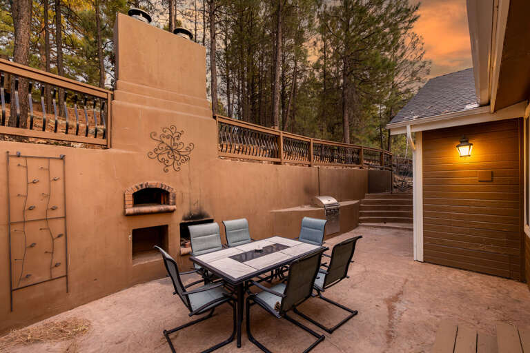 Unwind on the patio, fire up the built-in propane grill, or enjoy a wood-fired pizza oven, outdoor fireplace and seating for 6 Unwind on the patio, fire up the built-in propane grill, or enjoy a wood-fired pizza oven, outdoor fireplace and seating for 6