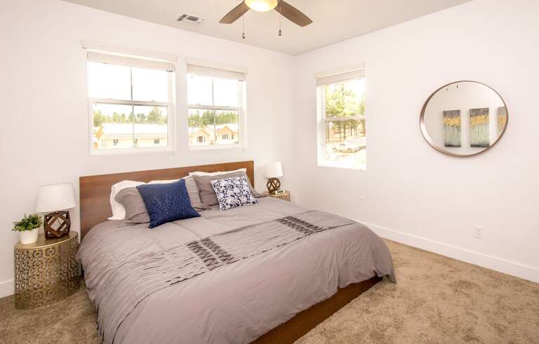 Bedroom 2: Boasts a king-sized bed and a warm, inviting atmosphere. Bedroom 2: Boasts a king-sized bed and a warm, inviting atmosphere.