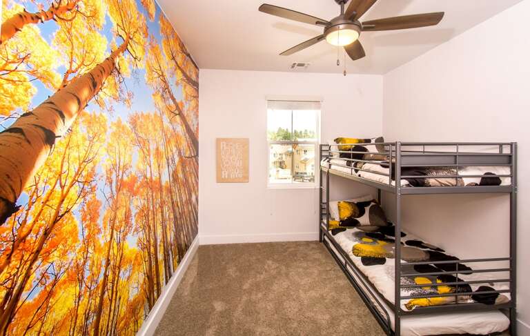 Bedroom 3: Includes twin bunk beds and a vibrant, playful wall mural—perfect for kids. Bedroom 3: Includes twin bunk beds and a vibrant, playful wall mural—perfect for kids.