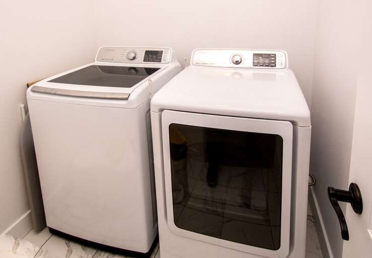 Laundry area - Essentials included: paper towels, toilet paper, laundry detergent, dish soap, dishwasher soap, and hand soap. Laundry area - Essentials included: paper towels, toilet paper, laundry detergent, dish soap, dishwasher soap, and hand soap.