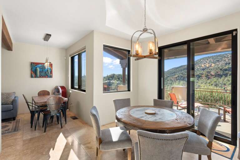 Adjacent dining area with seating for 10 across two tables Adjacent dining area with seating for 10 across two tables