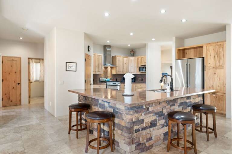 Barstool seating for 4 to overlook the kitchen. Barstool seating for 4 to overlook the kitchen.