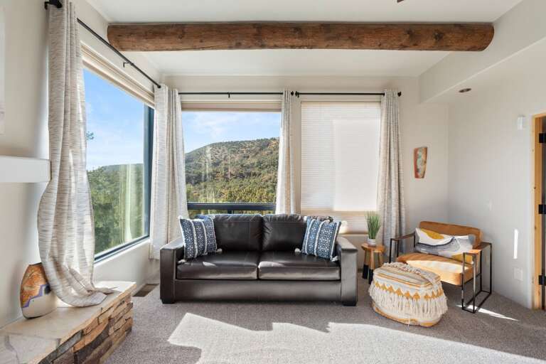 Main suite sitting area with a Queen pull-out leather sofa Main suite sitting area with a Queen pull-out leather sofa