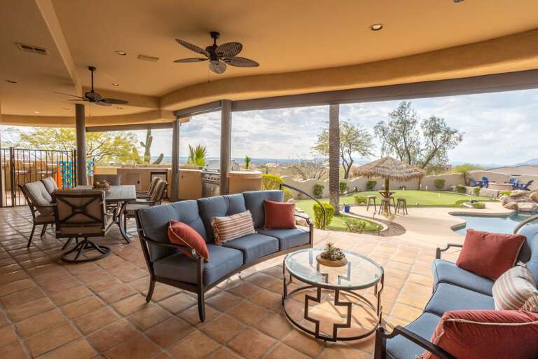 Outdoor Seating Area w/ Putting Green & Pool in Background Outdoor Seating Area w/ Putting Green & Pool in Background