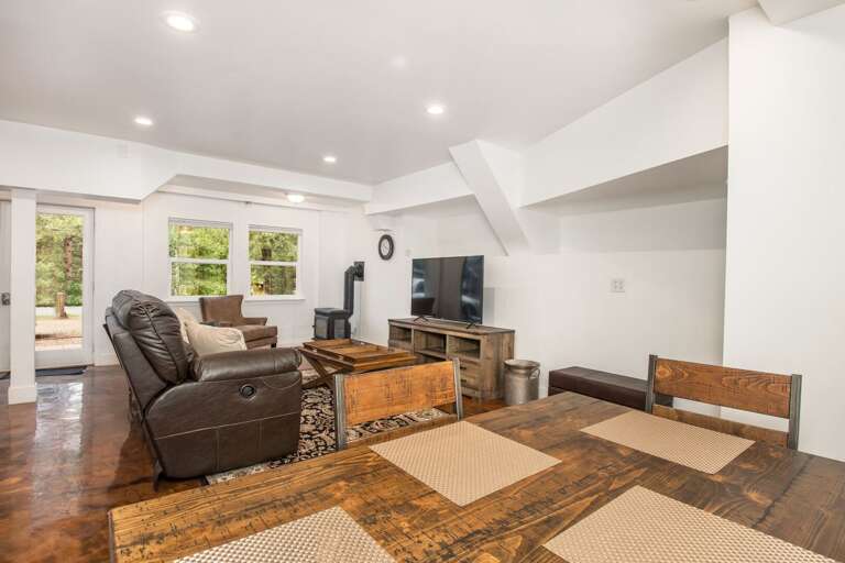 A gas fireplace adds warmth and character, while a flat-screen TV provides entertainment.