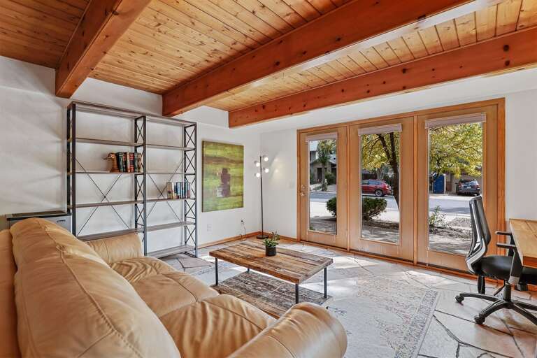 The living space invites you in with its stylish, welcoming vibe. Relax on a plush couch in front of the gas fireplace, perfect for curling up on cool Flagstaff evenings.