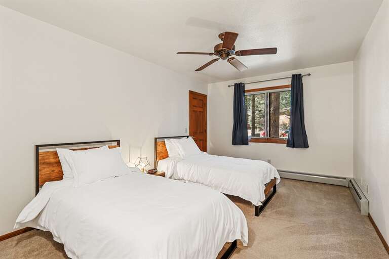 Bedroom 4: Includes a Queen-size air mattress and two Twin beds, with serene backyard views, also sharing access to the third full bathroom in Right Wing. Bedroom 4: Includes a Queen-size air mattress and two Twin beds, with serene backyard views, also sharing access to the third full bathroom in Right Wing.