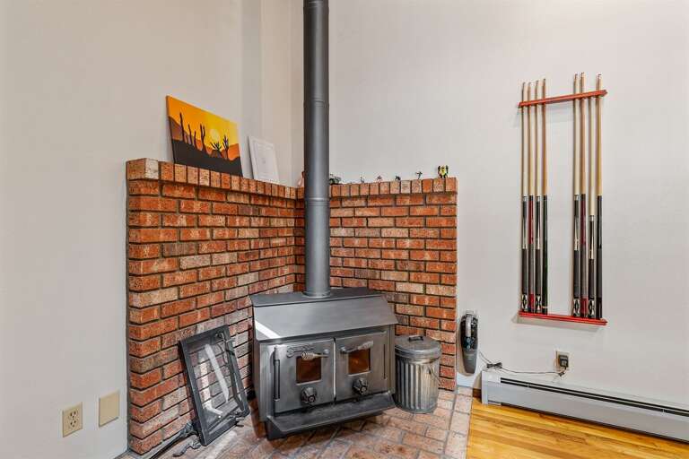Charming wood-burning stove in the game room Charming wood-burning stove in the game room