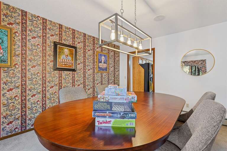 Poker table for those all-in moments and home is also stocked with board games (because Monopoly never gets old… right?) Poker table for those all-in moments and home is also stocked with board games (because Monopoly never gets old… right?)