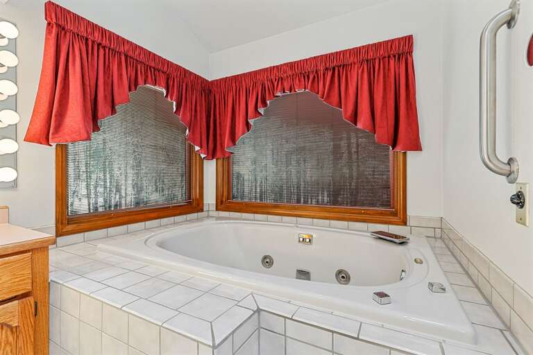 Primary Suite (Bedroom 1): Spacious room with a King bed, Crib, a very large walk-in closet and an oversized tiled walk-in shower, and a jacuzzi tub in the private en-suite bathroom. Primary Suite (Bedroom 1): Spacious room with a King bed, Crib, a very large walk-in closet and an oversized tiled walk-in shower, and a jacuzzi tub in the private en-suite bathroom.