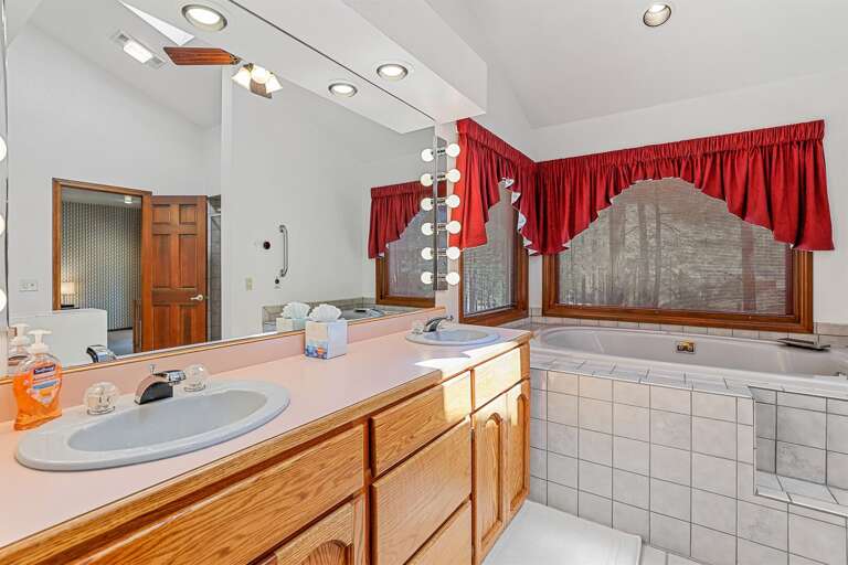 Primary Suite (Bedroom 1): Spacious room with a King bed, Crib, a very large walk-in closet and an oversized tiled walk-in shower, and a jacuzzi tub in the private en-suite bathroom. Primary Suite (Bedroom 1): Spacious room with a King bed, Crib, a very large walk-in closet and an oversized tiled walk-in shower, and a jacuzzi tub in the private en-suite bathroom.