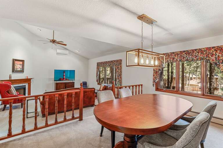 One room is perfect for cozying up by the gas fireplace, while the other is your go-to for a lively retreat—complete with a pool table, poker table, and a charming wood-burning stove. One room is perfect for cozying up by the gas fireplace, while the other is your go-to for a lively retreat—complete with a pool table, poker table, and a charming wood-burning stove.