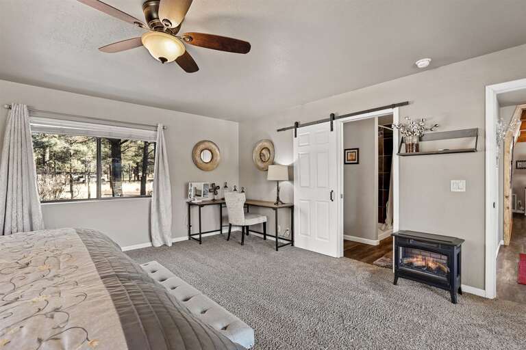 1st Floor - Master Bedroom 1: King Bed, private bathroom, a balcony with stunning mountain views, electric fireplace and a dedicated workspace. 1st Floor - Master Bedroom 1: King Bed, private bathroom, a balcony with stunning mountain views, electric fireplace and a dedicated workspace.