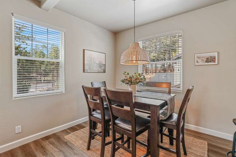Adjacent to the kitchen is a gorgeous dining table perfect for family dinners or board games. Adjacent to the kitchen is a gorgeous dining table perfect for family dinners or board games.