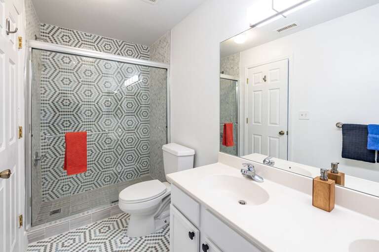 a full bath with another beautifully tiled shower. a full bath with another beautifully tiled shower.