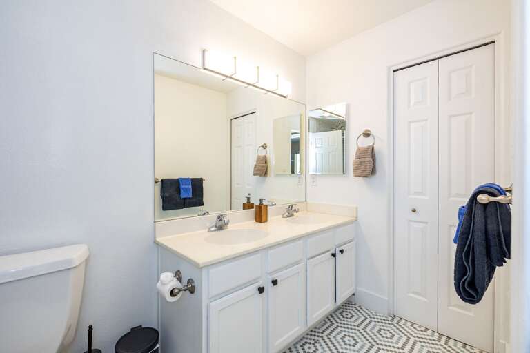 Shared Full Bathroom – Features a beautifully tiled shower and all essentials. Shared Full Bathroom – Features a beautifully tiled shower and all essentials.