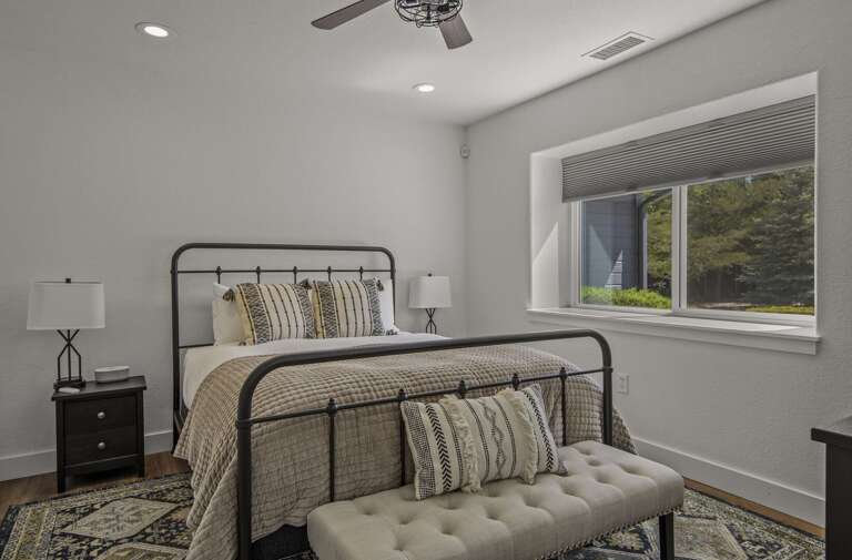 1st Bedroom: Queen bed, cozy tufted seating bench, and 2 end tables. 1st Bedroom: Queen bed, cozy tufted seating bench, and 2 end tables.