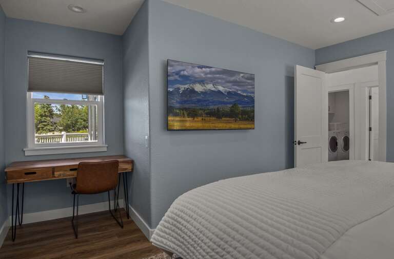 2nd Bedroom: King bed with a desk and lake views. An attached en-suite bathroom includes twin quartz vanities and a glass walk-in shower. 2nd Bedroom: King bed with a desk and lake views. An attached en-suite bathroom includes twin quartz vanities and a glass walk-in shower.