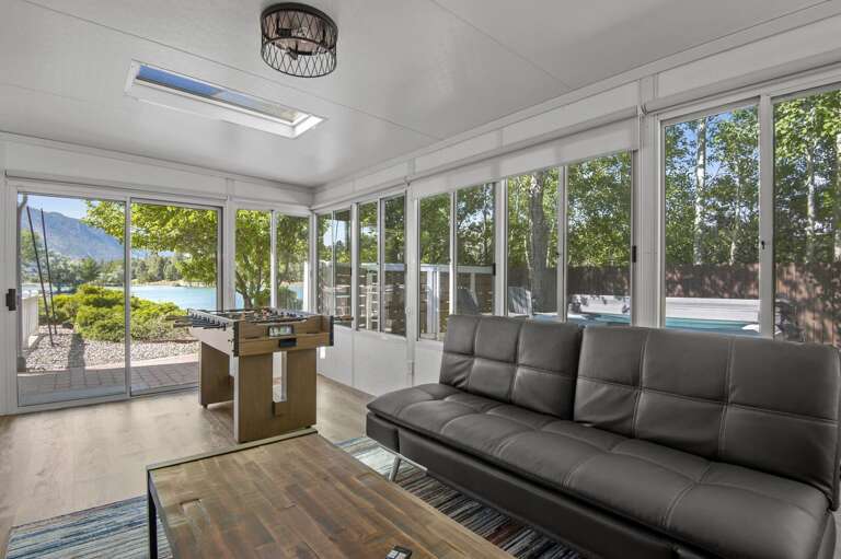 The game room lies behind the primary bedroom. The perfect spot for entertaining, it holds a futon couch. The game room lies behind the primary bedroom. The perfect spot for entertaining, it holds a futon couch.