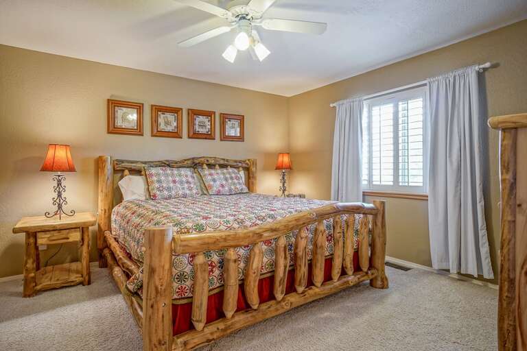 Main Level: Master Suite – King bed, spacious closet, and en suite bathroom with walk-in shower, plus access to the private outdoor patio. Main Level: Master Suite – King bed, spacious closet, and en suite bathroom with walk-in shower, plus access to the private outdoor patio.