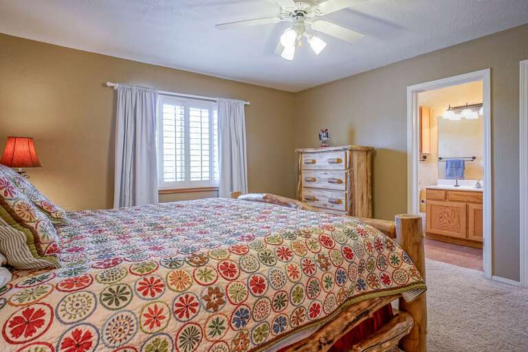 Main Level: Master Suite – King bed, spacious closet, and en suite bathroom with walk-in shower, plus access to the private outdoor patio. Main Level: Master Suite – King bed, spacious closet, and en suite bathroom with walk-in shower, plus access to the private outdoor patio.