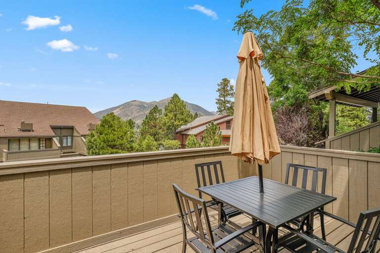 private deck with a table, umbrella, and chair set for 4. The mountain views from this deck are certainly One Of A Kind! private deck with a table, umbrella, and chair set for 4. The mountain views from this deck are certainly One Of A Kind!