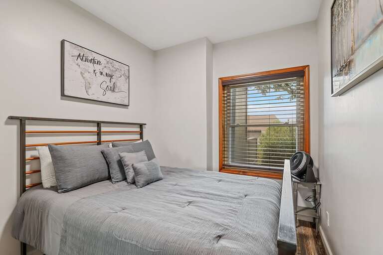 Queen Bedroom: Serene space with tasteful wall art and ample closet space. Twin Cot: Available for an additional guest. Queen Bedroom: Serene space with tasteful wall art and ample closet space. Twin Cot: Available for an additional guest.