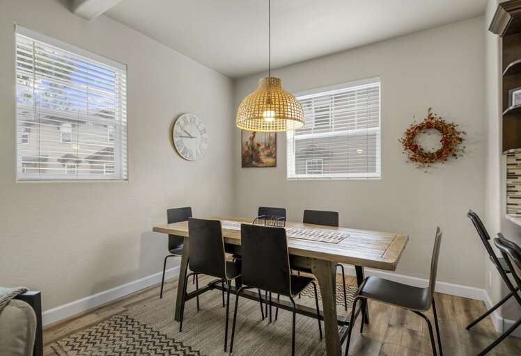 With a dining table for eight and a breakfast bar for two, family dinner or game night has never felt this chic. With a dining table for eight and a breakfast bar for two, family dinner or game night has never felt this chic.