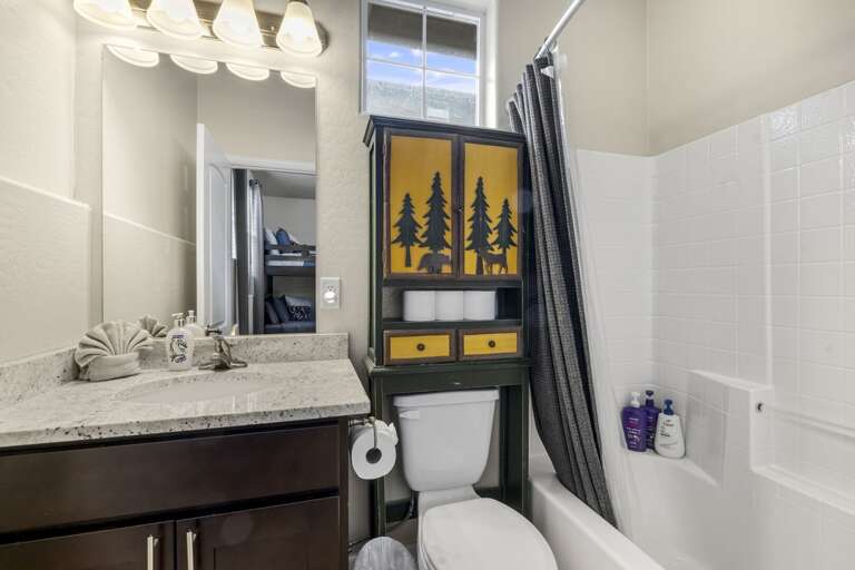 En suite bathroom with shower/tub combo. En suite bathroom with shower/tub combo.