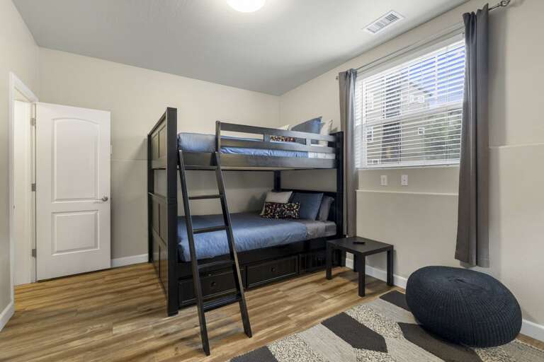 Queen-sized Bunk Beds for 4, Smart TV, walk-in closet, and an en suite bathroom with shower/tub combo. Queen-sized Bunk Beds for 4, Smart TV, walk-in closet, and an en suite bathroom with shower/tub combo.