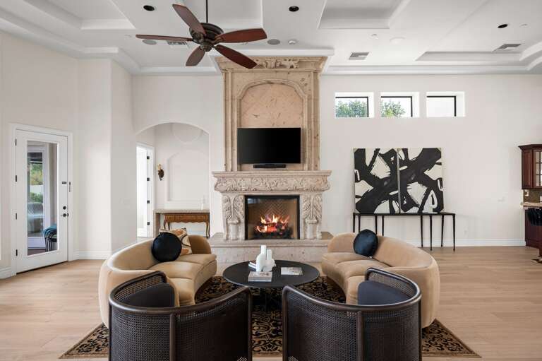 Gather around the fireplace, creating a warm and inviting atmosphere. Gather around the fireplace, creating a warm and inviting atmosphere.