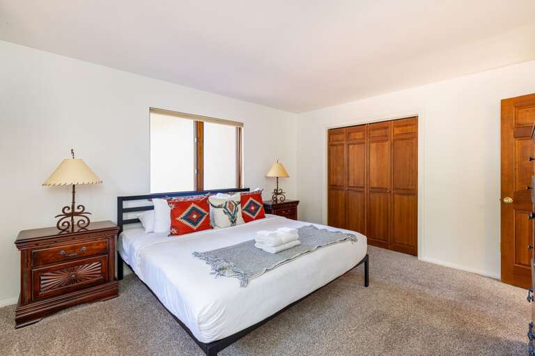 Bedroom 2 – King bed with natural light, serene views and large clothing storage. Bedroom 2 – King bed with natural light, serene views and large clothing storage.
