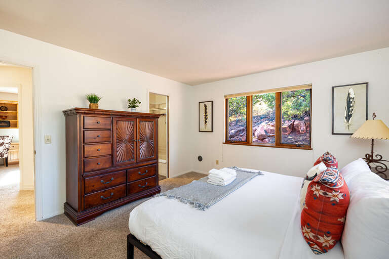 Bedroom 2 – King bed with natural light, serene views and large clothing storage. Bedroom 2 – King bed with natural light, serene views and large clothing storage.