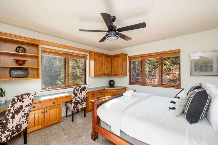 Bedroom 3 – Queen bed with cozy touches and dedicated workspace for 2 with sweeping views. Bedroom 3 – Queen bed with cozy touches and dedicated workspace for 2 with sweeping views.